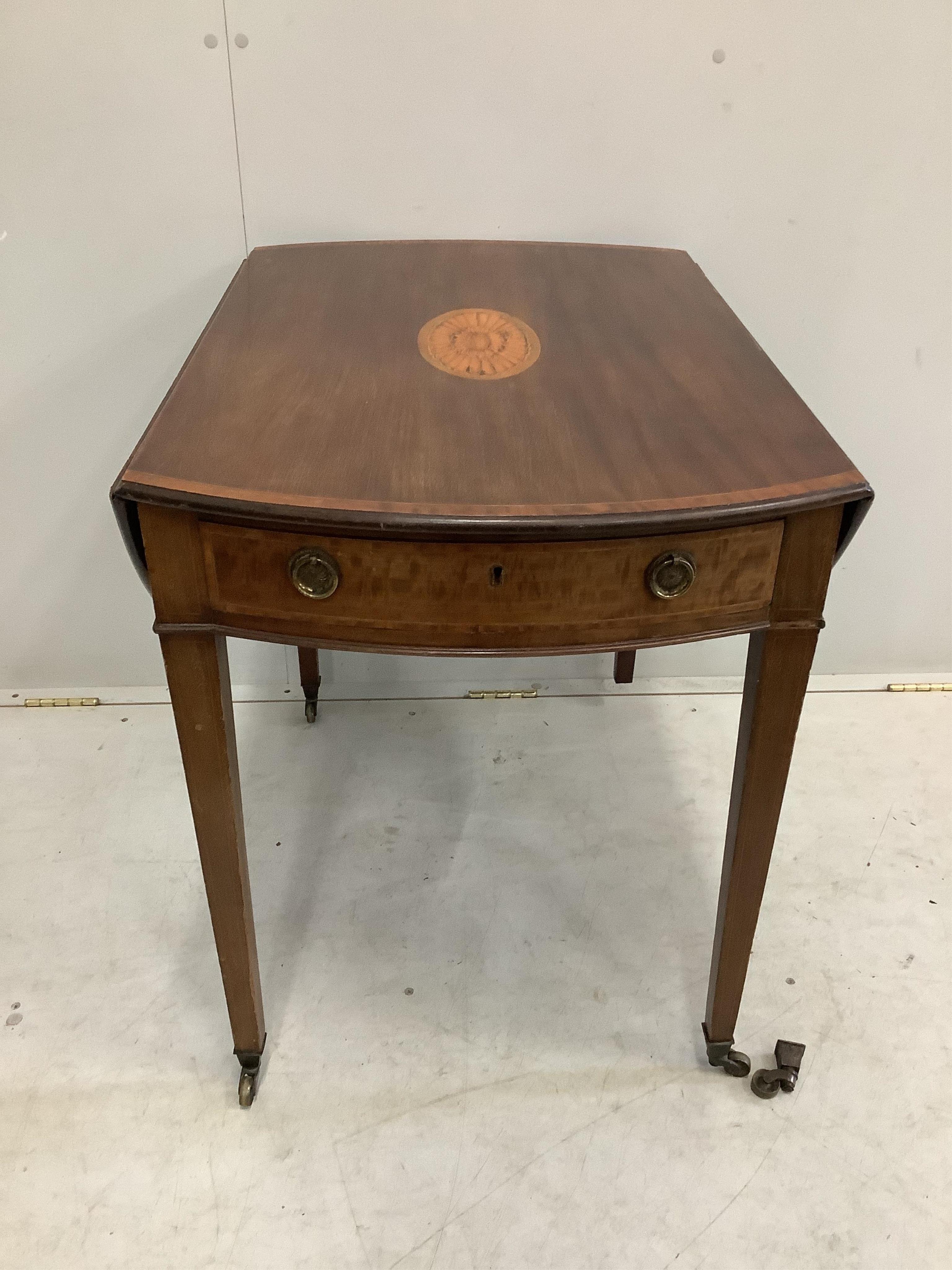 A George III crossbanded and paterae inlaid mahogany Pembroke table, width 83cm, depth 55cm, height 70cm. Condition - poor to fair